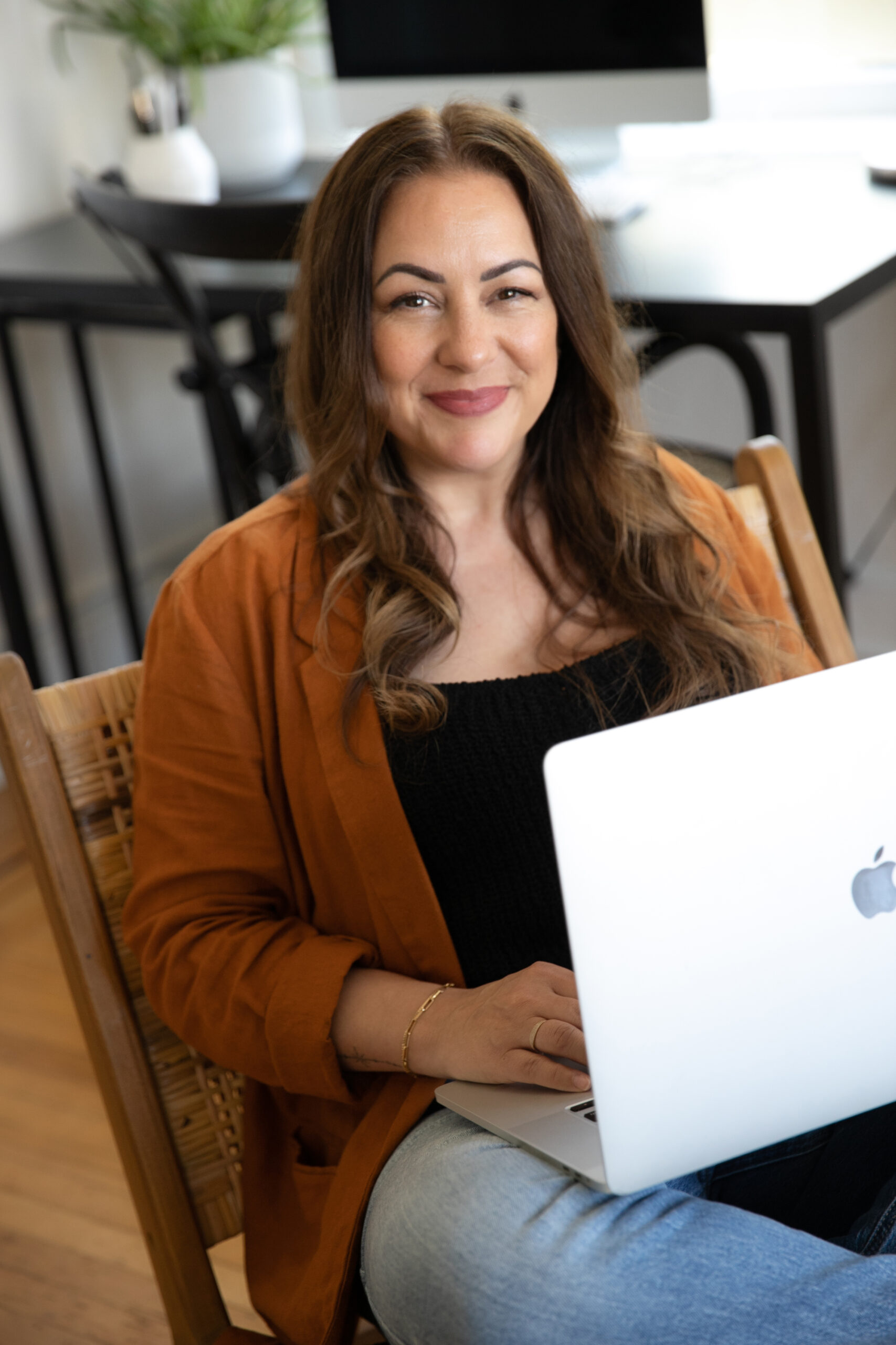 girl with computer in chair